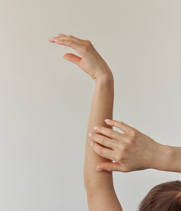 Woman in a graceful yoga pose with lilac accents.